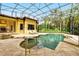 Backyard screened pool with patio seating, providing a private oasis at 11055 Ullswater Ln, Windermere, FL 34786