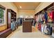 Large walk-in closet with custom shelving, storage, and natural light at 11055 Ullswater Ln, Windermere, FL 34786