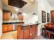 Entertain in this stylish wet bar with custom cabinets, granite counters, and ample seating at 11055 Ullswater Ln, Windermere, FL 34786
