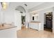 Bright, spacious bathroom featuring granite countertops, arched ceiling and access to a large closet and bedroom at 1128 Brantley Estates Dr, Altamonte Springs, FL 32714