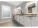Bathroom with double sink vanity, granite countertop, and tile floors at 1128 Brantley Estates Dr, Altamonte Springs, FL 32714