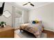 Inviting bedroom featuring a window and hardwood floors, providing a cozy and comfortable living space at 1128 Brantley Estates Dr, Altamonte Springs, FL 32714