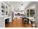 Bright, white modern kitchen with island, ample cabinet space, and breakfast area at 1128 Brantley Estates Dr, Altamonte Springs, FL 32714