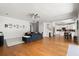Bright and open living area with hardwood floors, flowing into the kitchen at 1128 Brantley Estates Dr, Altamonte Springs, FL 32714