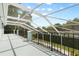 Screened-in patio with metal fencing and a peaceful backyard view at 1128 Brantley Estates Dr, Altamonte Springs, FL 32714