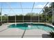A lovely screened-in pool with crystal clear water and an inflatable flamingo, surrounded by a spacious deck at 1128 Brantley Estates Dr, Altamonte Springs, FL 32714