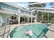 Relaxing screened-in pool area with ample seating and a fun flamingo float at 1128 Brantley Estates Dr, Altamonte Springs, FL 32714