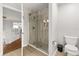 Modern bathroom featuring a walk-in shower with sliding glass door and neutral finishes at 1128 Brantley Estates Dr, Altamonte Springs, FL 32714