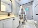 Bathroom featuring tile flooring, shower-tub, vanity with storage, updated faucet and hardware at 1200 Montheath Cir, Ocoee, FL 34761