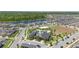 Aerial view of a Primary-planned community featuring a lake, swimming pool, clubhouse, and playground at 12048 Imaginary Way, Orlando, FL 32832