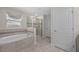 The bathroom features a soaking tub with tile surround, a glass-enclosed shower, and a linen closet at 12048 Imaginary Way, Orlando, FL 32832