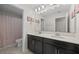Bright bathroom with a double vanity, ample counter space, and a private toilet area at 12048 Imaginary Way, Orlando, FL 32832