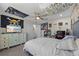 The bedroom includes a ceiling fan, a TV, and a themed decor for a personalized space at 12048 Imaginary Way, Orlando, FL 32832