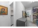 Hallway featuring a laundry room, storage, and access to other rooms at 12048 Imaginary Way, Orlando, FL 32832