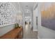 Elegant hallway featuring stylish decor, paneled walls, and views into adjacent rooms, enhancing the home's ambiance at 12048 Imaginary Way, Orlando, FL 32832