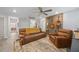 Spacious living room with guitars, a plush sofa, recliner, and a stylish decor, creating a cozy ambiance at 12048 Imaginary Way, Orlando, FL 32832