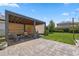 Backyard pergola featuring a lounge area, an egg chair, and paver flooring at 12048 Imaginary Way, Orlando, FL 32832