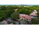 An aerial view showcasing the community buildings, surrounding mature landscaping and convenient parking at 1270 Saint Tropez Cir # Ge, Orlando, FL 32806