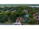 Aerial view of a community with tennis court, fountain, and beautifully manicured grounds at 1270 Saint Tropez Cir # Ge, Orlando, FL 32806