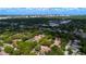 Stunning aerial view of residential community, showcasing mature trees and proximity to the cityscape skyline at 1270 Saint Tropez Cir # Ge, Orlando, FL 32806