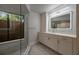 A bright bathroom showcases a modern shower with a glass enclosure and a vanity with sleek fixtures at 1270 Saint Tropez Cir # Ge, Orlando, FL 32806