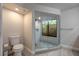 A contemporary bathroom features a glass shower enclosure, a toilet, and clean, white finishes at 1270 Saint Tropez Cir # Ge, Orlando, FL 32806