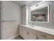 A renovated bathroom features a large lighted mirror, vanity with storage, and modern fixtures at 1270 Saint Tropez Cir # Ge, Orlando, FL 32806