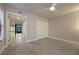 Spacious bedroom with ceiling fan, closet and wood-look tile flooring for a modern aesthetic at 1270 Saint Tropez Cir # Ge, Orlando, FL 32806