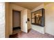 Tiled condo entrance featuring a sidelight, a small window, and storage closet at 1270 Saint Tropez Cir # Ge, Orlando, FL 32806