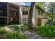Exterior view of the house and rear lanai at 1270 Saint Tropez Cir # Ge, Orlando, FL 32806