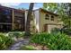 Exterior view of the house and rear lanai with manicured landscaping at 1270 Saint Tropez Cir # Ge, Orlando, FL 32806
