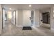 Inviting foyer with wood-look tile, a white front door, and access to the living spaces at 1270 Saint Tropez Cir # Ge, Orlando, FL 32806