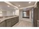 Renovated kitchen with granite countertops and stainless refrigerator near the window seating area at 1270 Saint Tropez Cir # Ge, Orlando, FL 32806