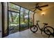 Enclosed lanai offers a view into a lush, landscaped yard at 1270 Saint Tropez Cir # Ge, Orlando, FL 32806