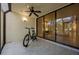 Enclosed lanai with ceiling fan and view into a living room at 1270 Saint Tropez Cir # Ge, Orlando, FL 32806