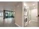 Hallway laundry room with a stackable washer and dryer at 1270 Saint Tropez Cir # Ge, Orlando, FL 32806