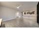 Inviting living area with tile flooring and views to the open kitchen and entry way at 1270 Saint Tropez Cir # Ge, Orlando, FL 32806