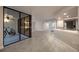 Open-concept living room with kitchen bar area, tile floors, and a sunroom at 1270 Saint Tropez Cir # Ge, Orlando, FL 32806