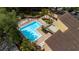 Aerial view of community pool with tanning deck, seating, landscaping, and nearby parking at 1270 Saint Tropez Cir # Ge, Orlando, FL 32806