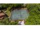 Aerial view of community tennis courts surrounded by lush greenery and trees, offering a recreational amenity at 1270 Saint Tropez Cir # Ge, Orlando, FL 32806