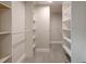 Spacious walk-in closet with custom shelving and laminate flooring at 1270 Saint Tropez Cir # Ge, Orlando, FL 32806