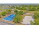 Community park with basketball and volleyball courts, walking paths, and scenic lake views at 13208 Canna Lily Dr, Orlando, FL 32824