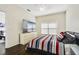 Bedroom with a large window and television at 13208 Canna Lily Dr, Orlando, FL 32824