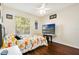 bedroom with window and television at 13208 Canna Lily Dr, Orlando, FL 32824