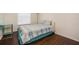 Cozy bedroom with natural light, laminate floors, and light blue accents at 13208 Canna Lily Dr, Orlando, FL 32824
