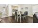 Elegant dining room with a mirror-topped table, perfect for Gathering dinners or hosting guests at 13208 Canna Lily Dr, Orlando, FL 32824