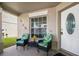 Inviting front porch with seating area, perfect for enjoying a morning coffee or relaxing in the evening at 13208 Canna Lily Dr, Orlando, FL 32824