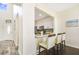 Cozy kitchen with modern appliances, white cabinets, and a breakfast bar with seating for three people at 13208 Canna Lily Dr, Orlando, FL 32824