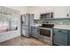 Well-lit kitchen with stainless steel appliances, ample cabinet space, and modern backsplash. Functional and stylish at 13208 Canna Lily Dr, Orlando, FL 32824