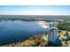 Stunning aerial view of lakeside condo buildings with pool and lush surrounding landscape at 13427 Blue Heron Beach Dr # 1205, Orlando, FL 32821